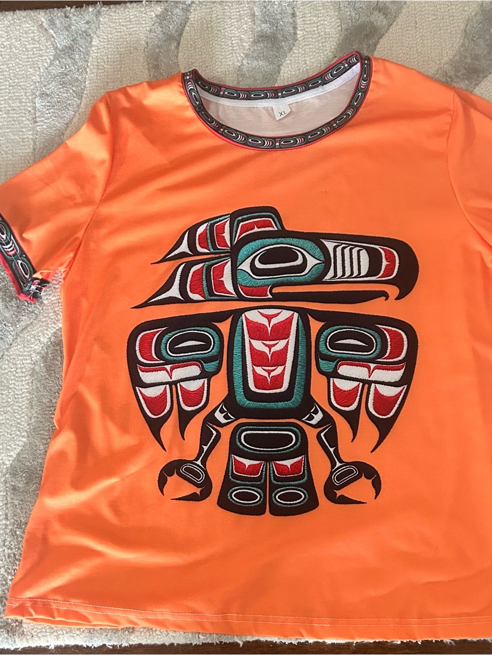 Orange Graphic Tee with Indigenous-Inspired in Print